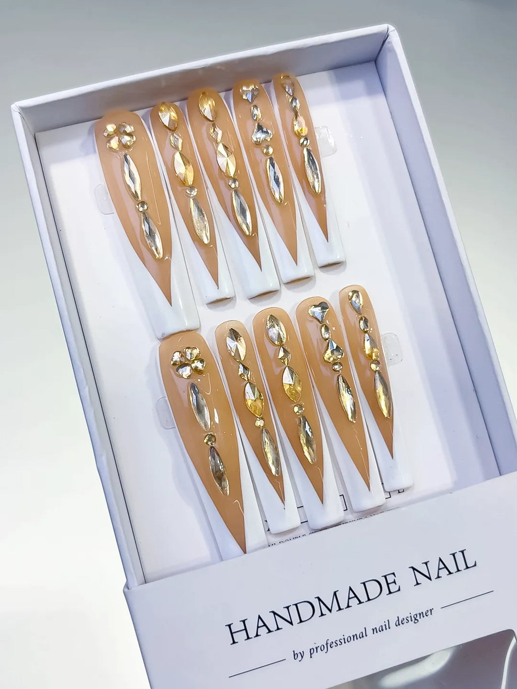 Nude White Gold Silver French tip Rhinestone press on nails angled view
