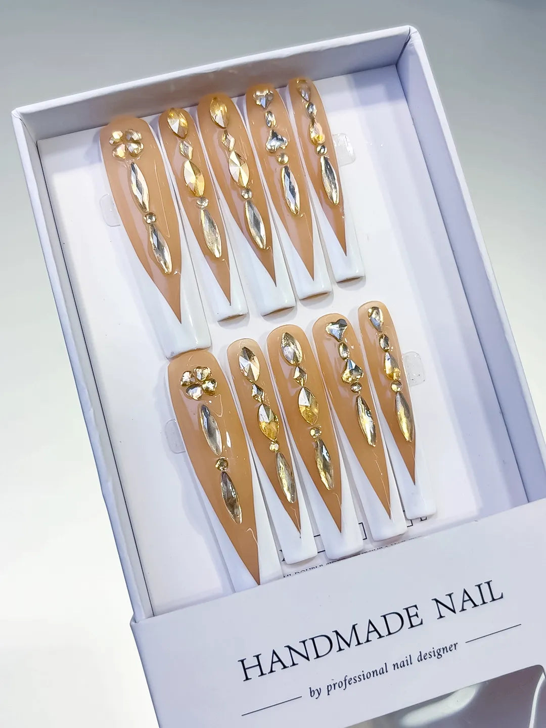 Nude White Gold Silver French tip Rhinestone press on nails angled view