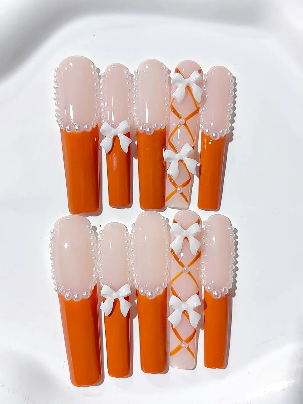 Nude Orange White Silver French tip Bow Pearl 3D press on nails detail view
