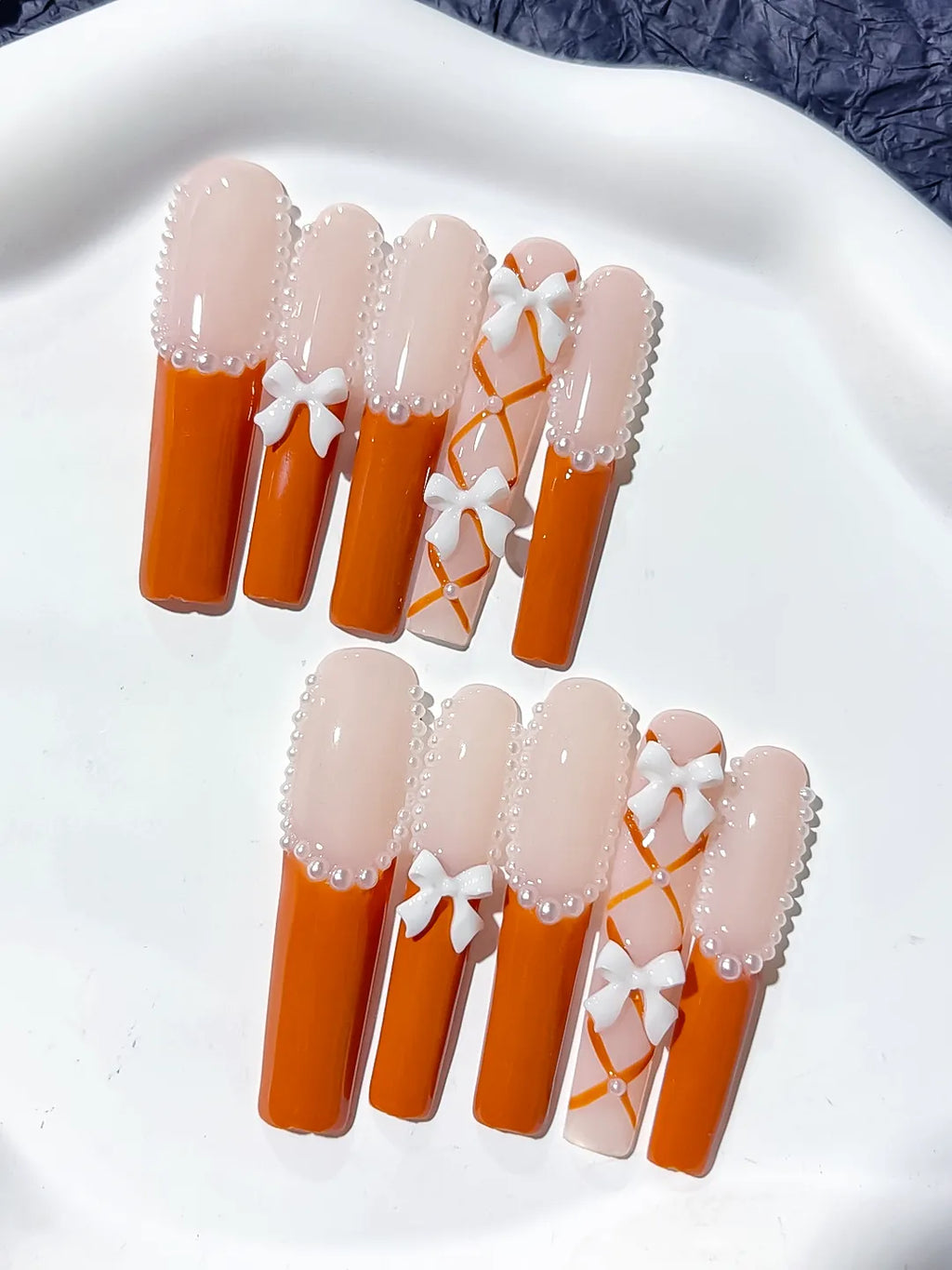 Nude Orange White Silver French tip Bow Pearl 3D press on nails detail view