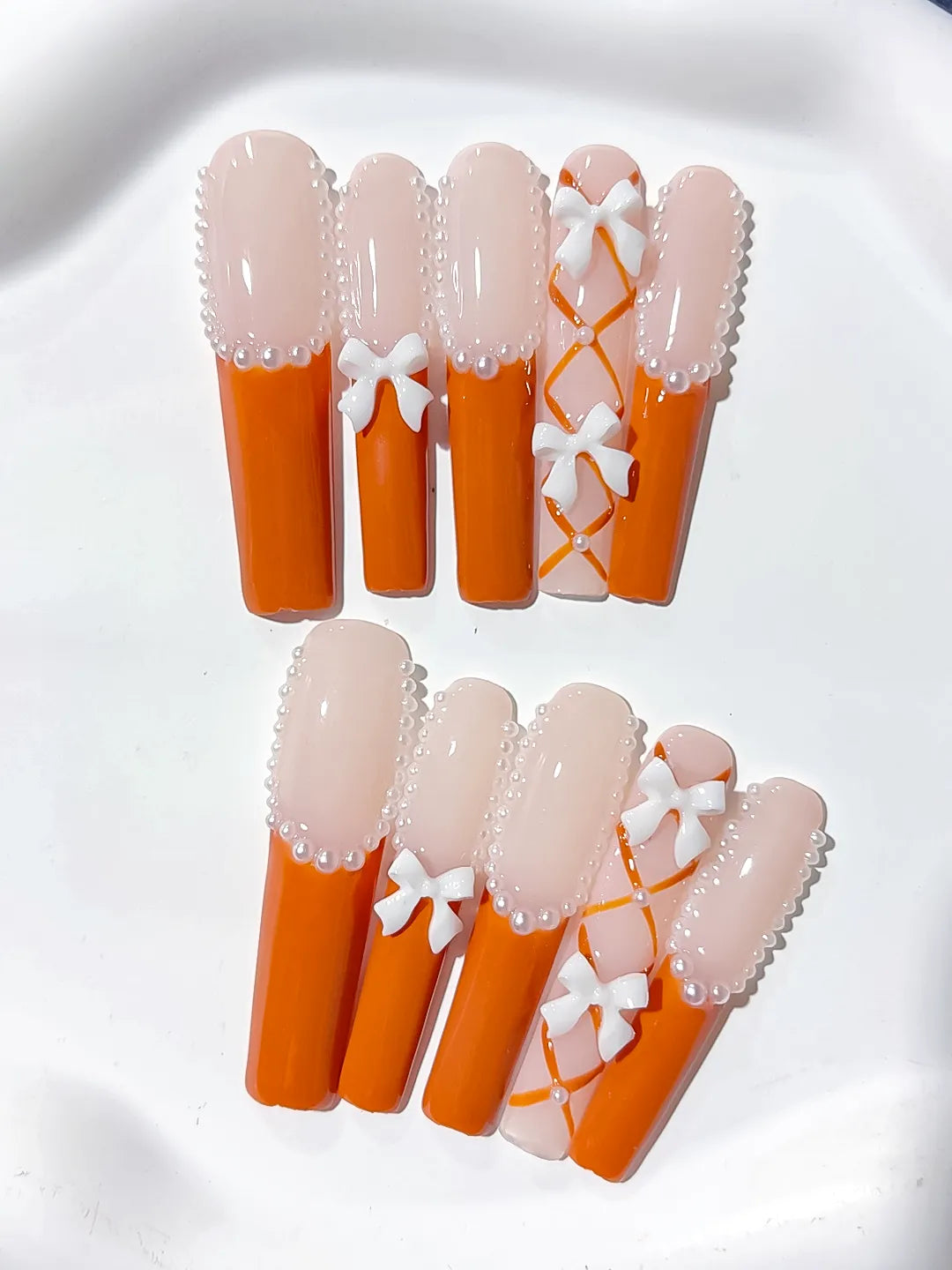 Nude Orange White Silver French tip Bow Pearl 3D press on nails detail view