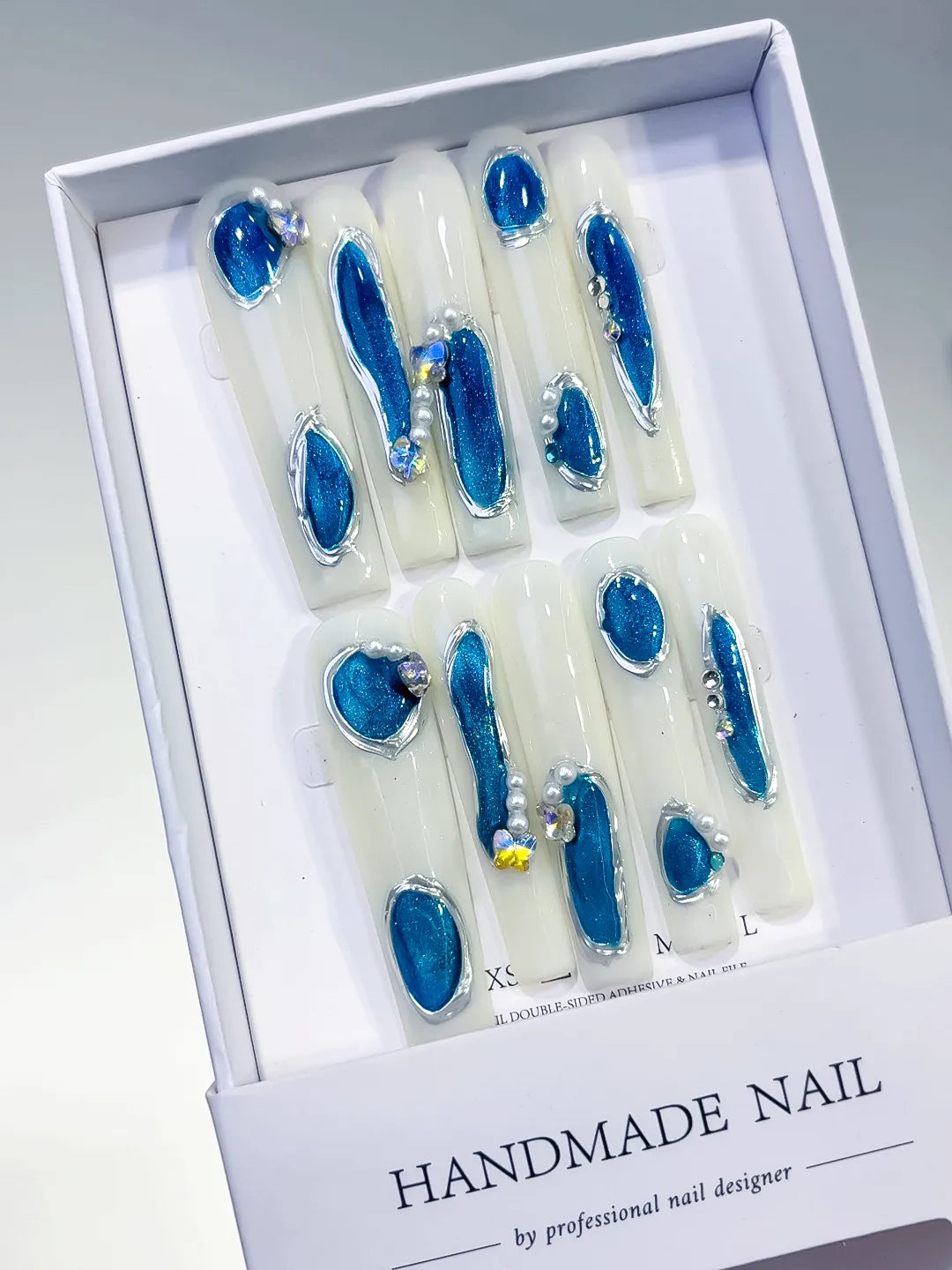 White Blue Silver Solid color Heart Pearl 3D press on nails angled view