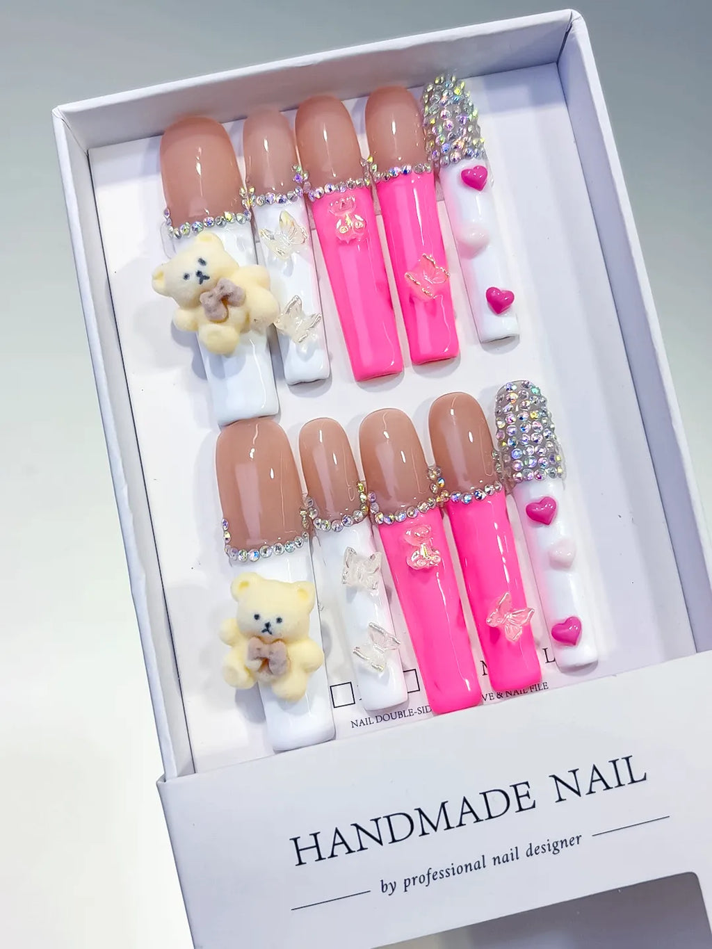 Nude White Pink Silver Solid color Bear Butterfly Heart Rhinestone 3D press on nails angled view