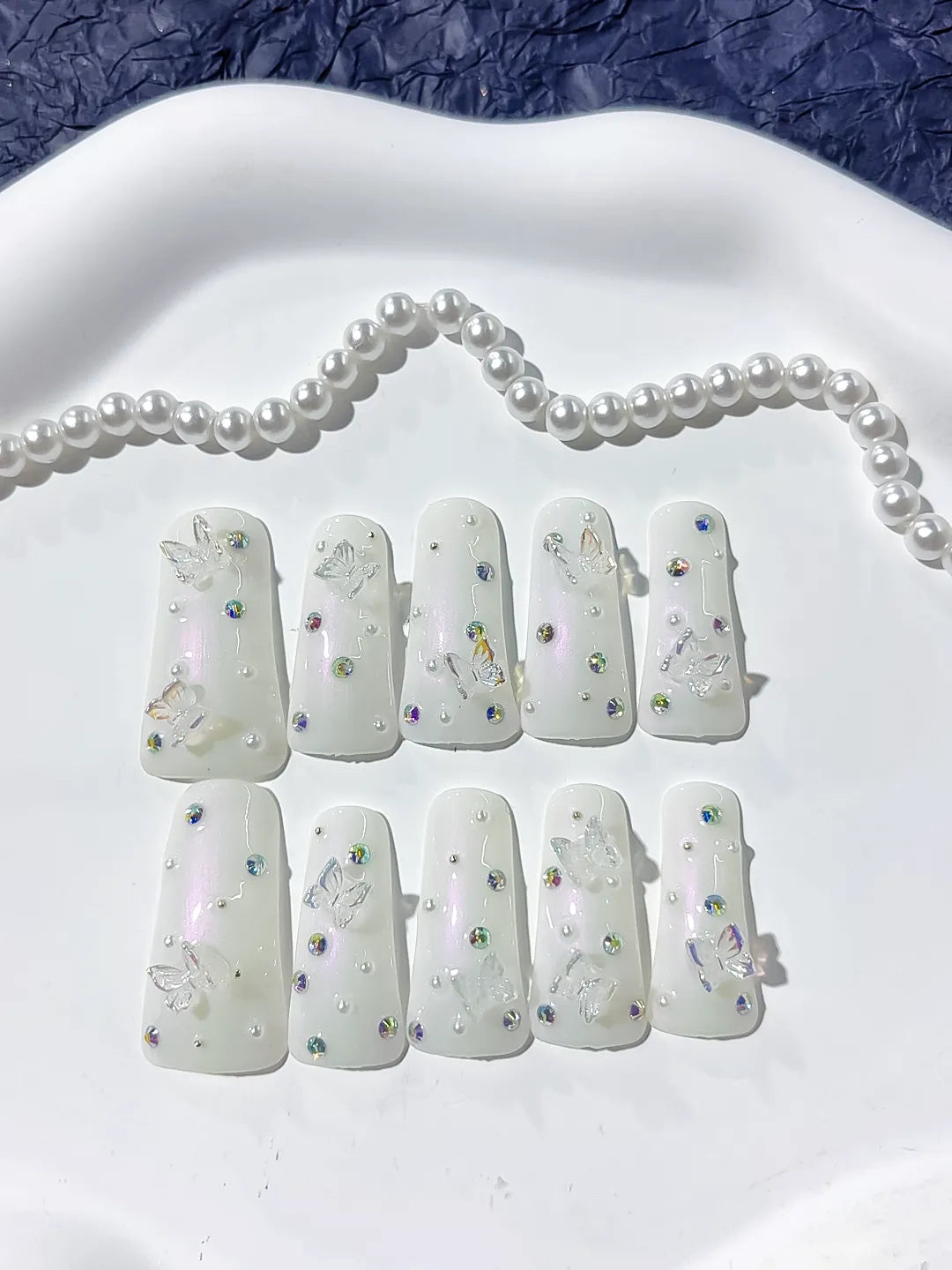 White Silver Multicolor Solid color Butterfly Pearl Rhinestone 3D press on nails close up