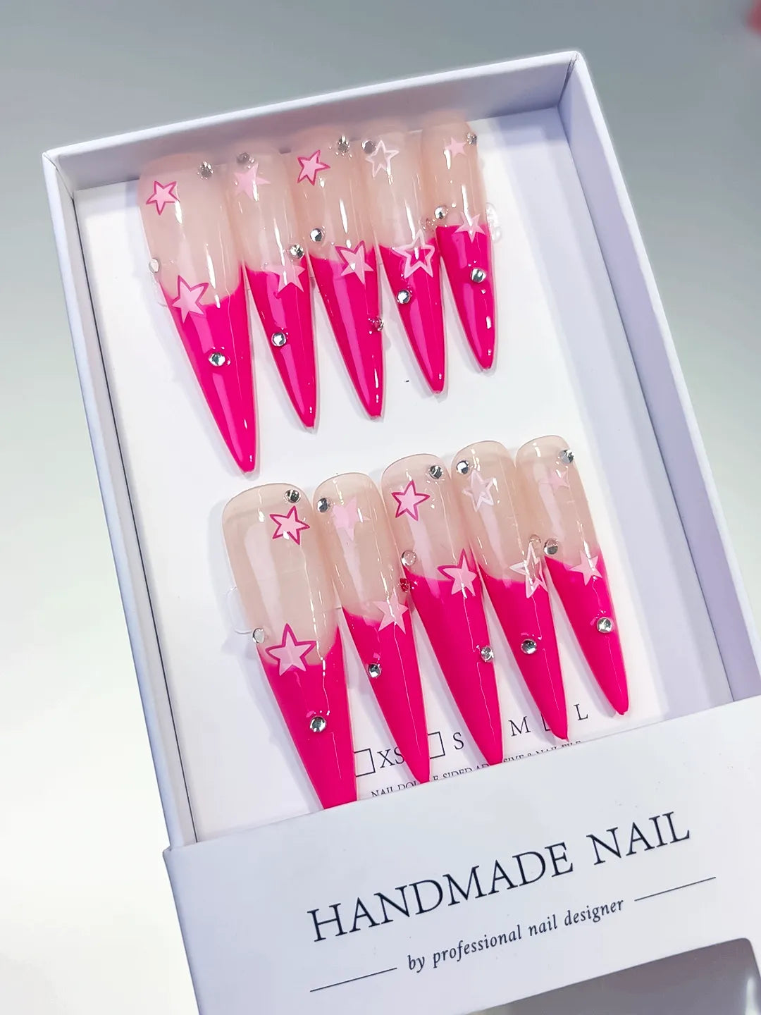 Nude Pink Silver French tip Rhinestone press on nails angled view