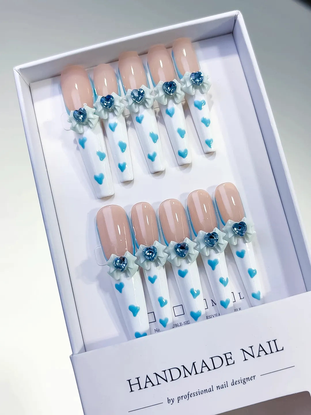 Nude White Blue French tip Bow Flower Heart 3D press on nails angled view