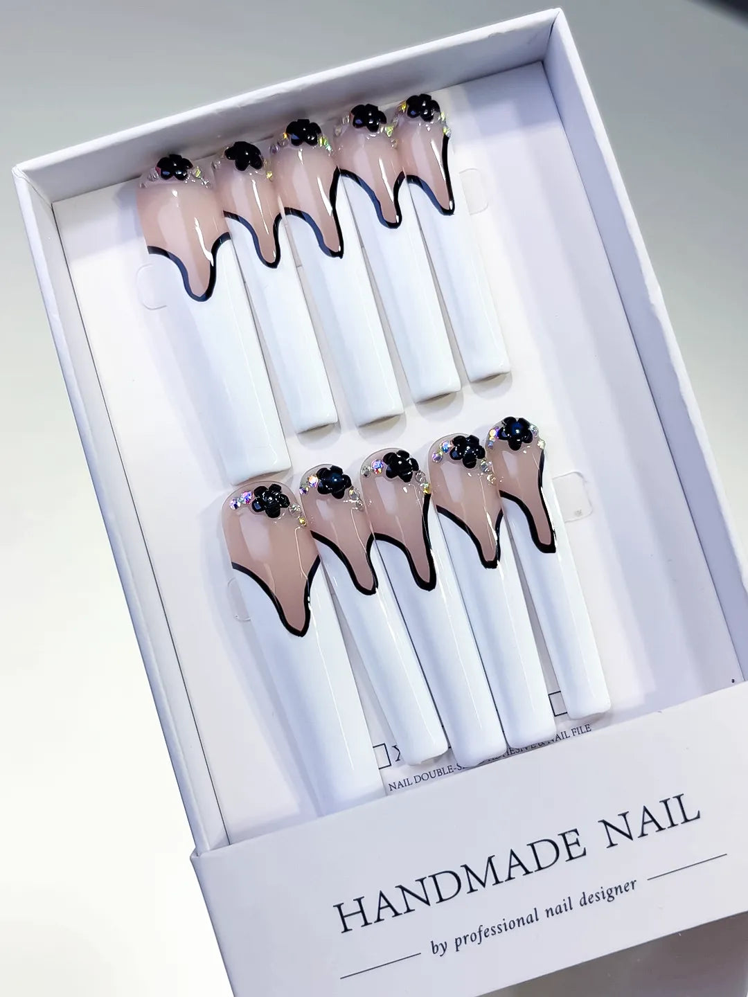 Nude White Black French tip Flower Rhinestone 3D press on nails angled view