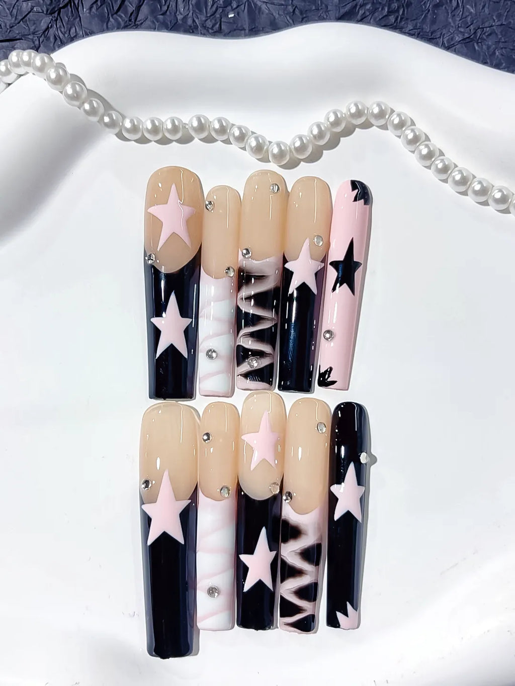 Nude White Pink Black Abstract Star Rhinestone 3D press on nails detail view
