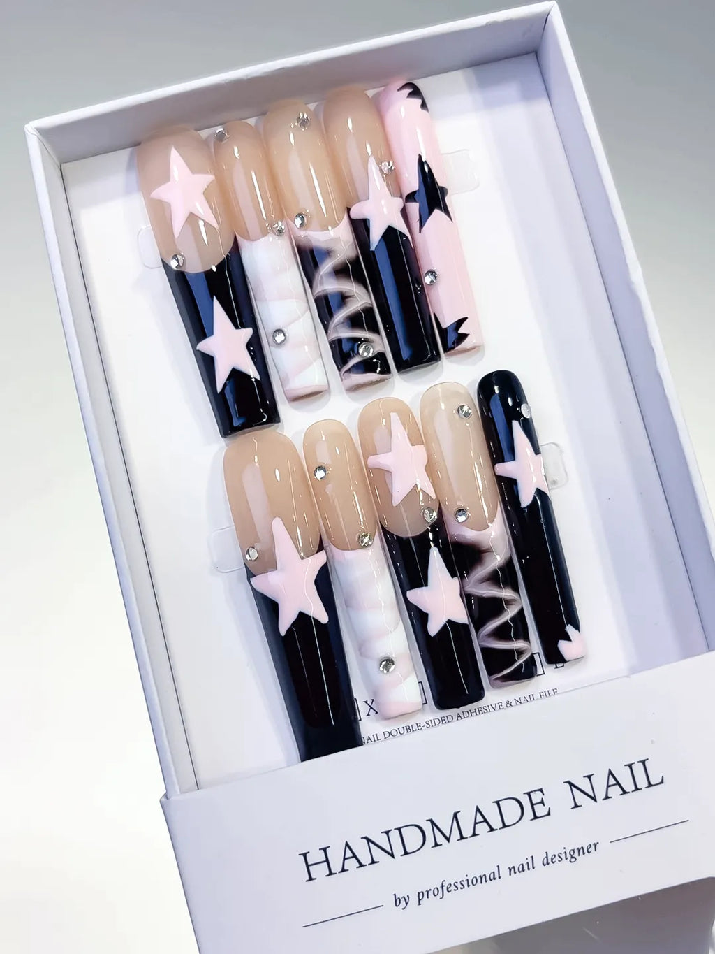 Nude White Pink Black Abstract Star Rhinestone 3D press on nails angled view