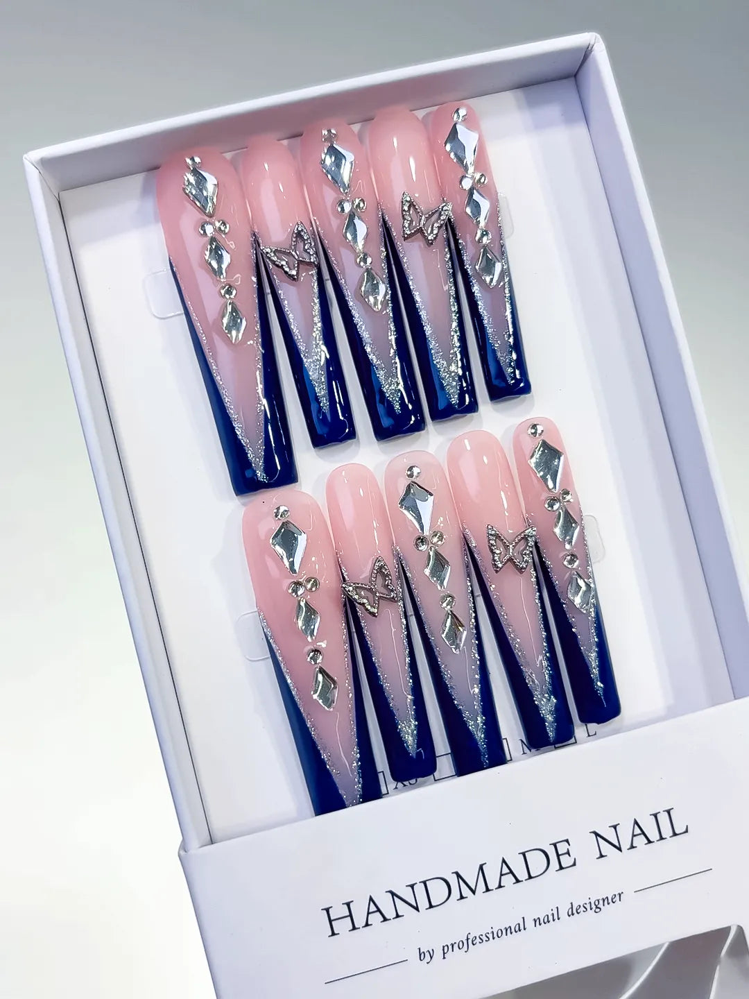 Nude Blue Silver French tip Butterfly Rhinestone press on nails angled view