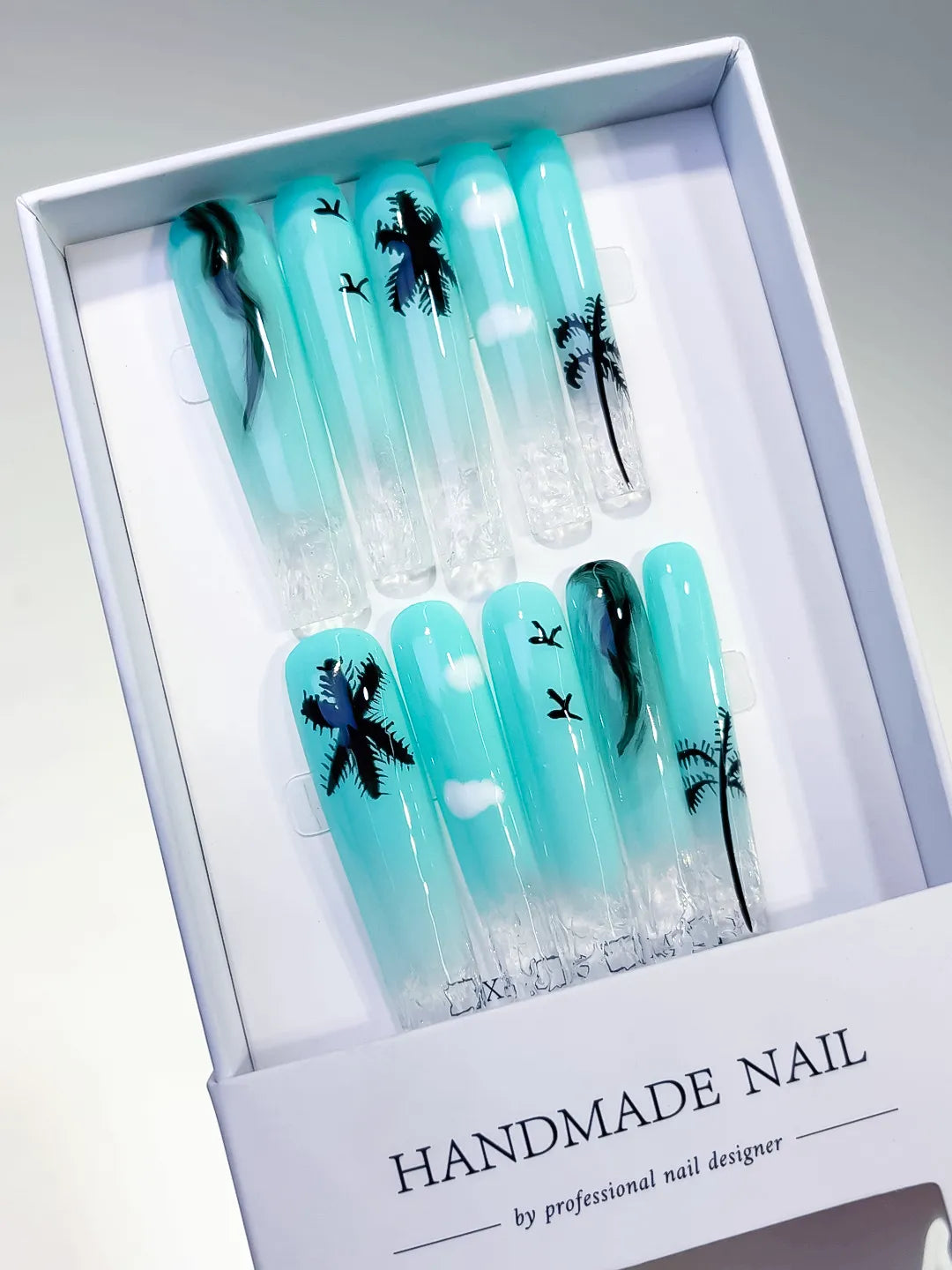 Blue White Black Ombre Palm Tree Cloud press on nails angled view