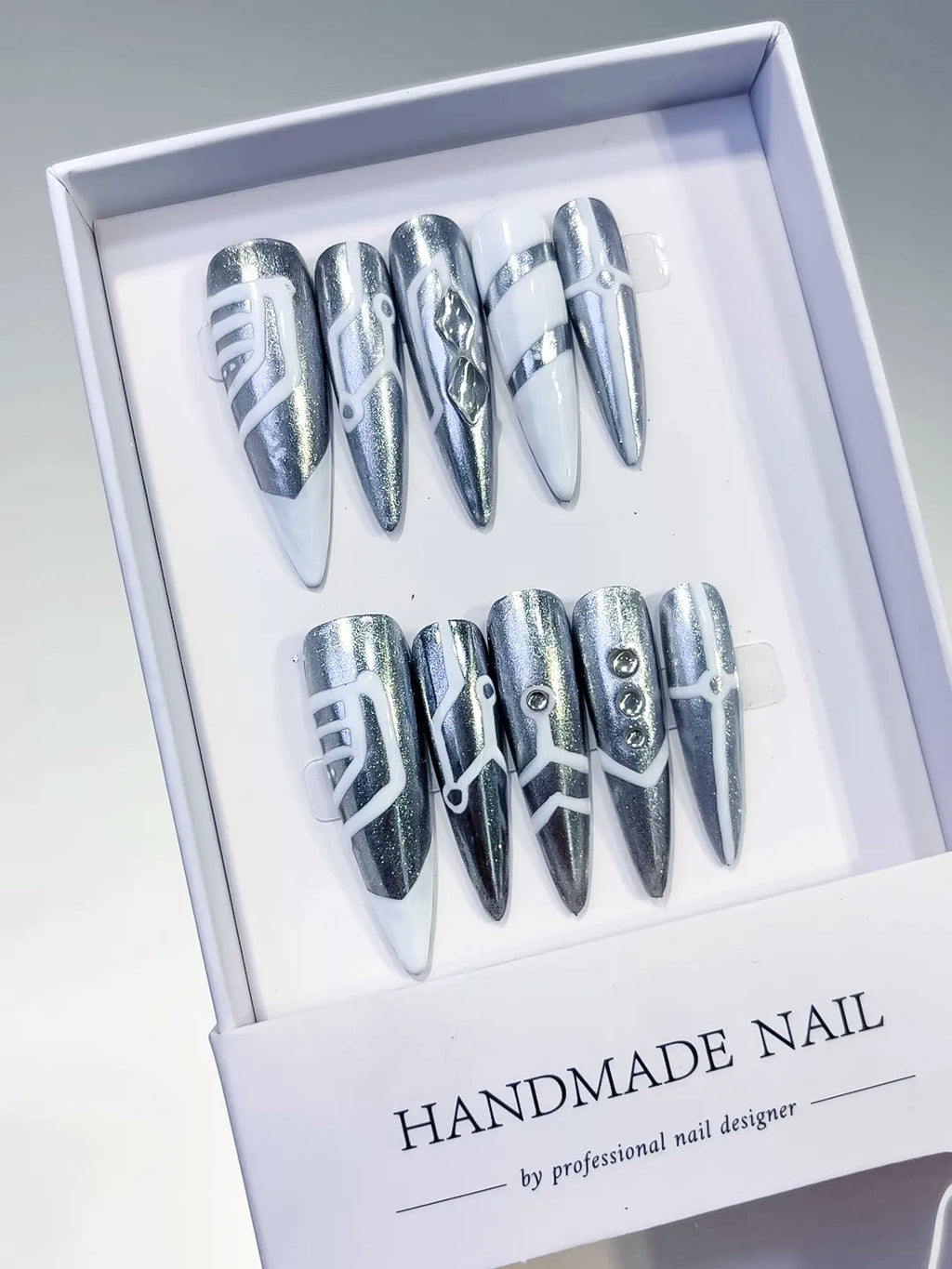 Silver White Metallic Geometric Stud press on nails angled view