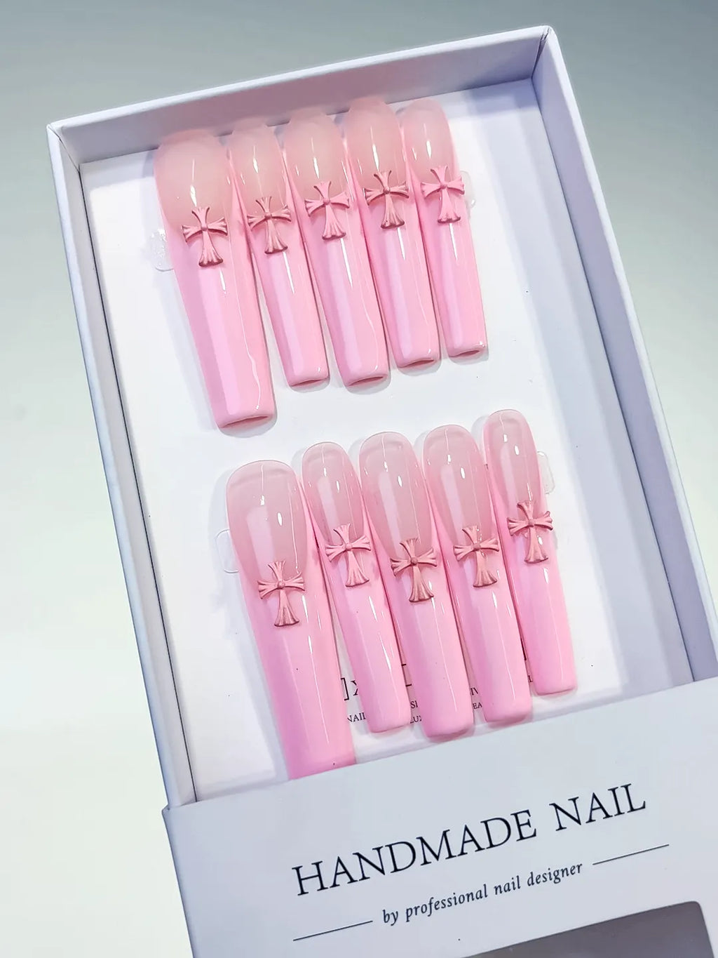 Pink Solid color Cross 3D press on nails angled view