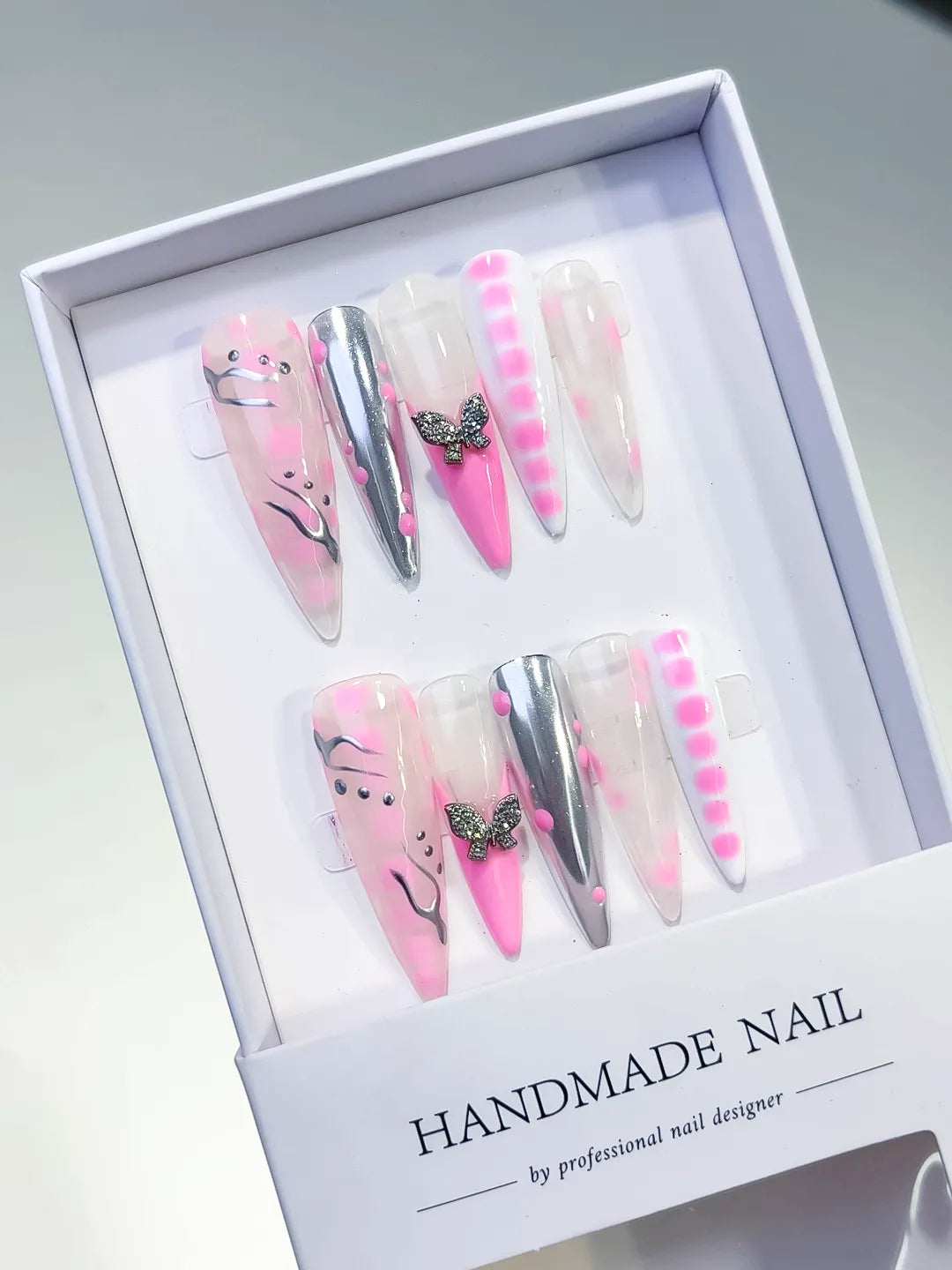 Pink White Silver Abstract Butterfly press on nails angled view