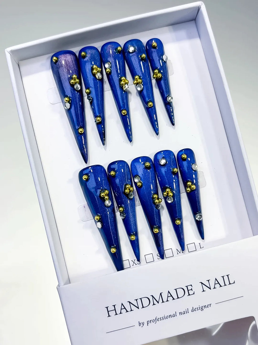 Blue Gold Silver Metallic Stud press on nails angled view