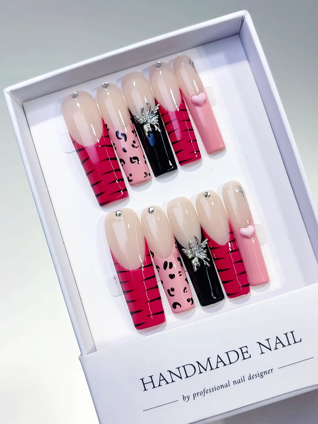 Nude Pink Black Abstract Animal Print Glitter press on nails angled view