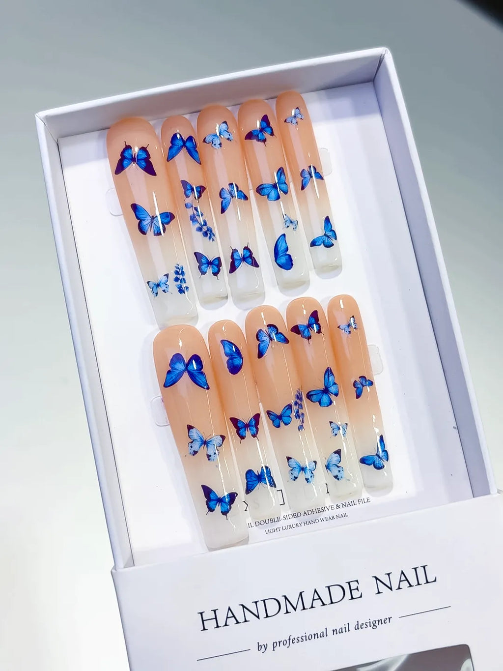 Nude Blue White Solid color Butterfly press on nails angled view