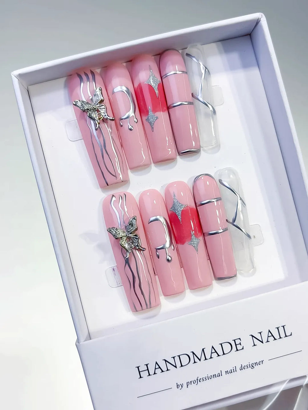 Pink Silver Solid color Butterfly Star Rhinestone press on nails angled view