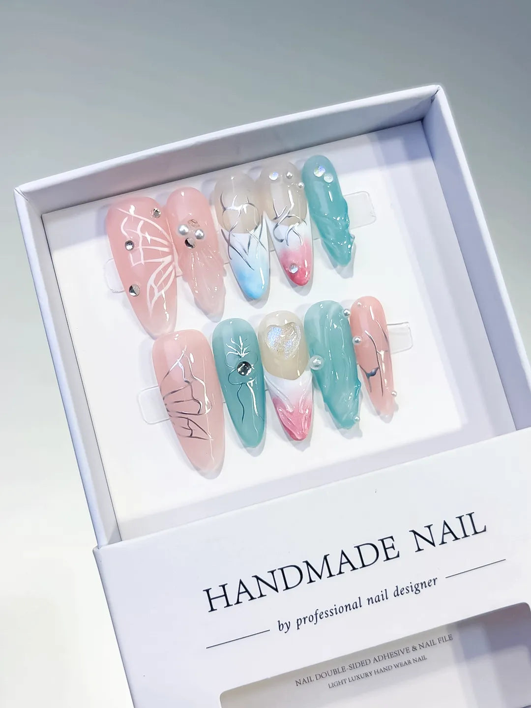 Pink Blue White Silver Abstract Butterfly Pearl press on nails angled view