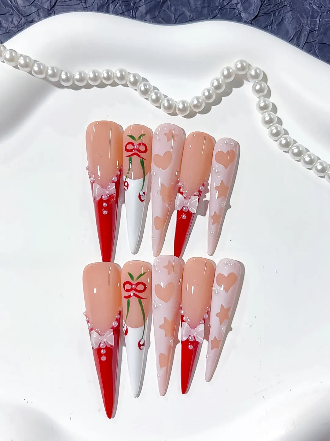 Nude Red White Pink Abstract Cherry Bow press on nails detail view