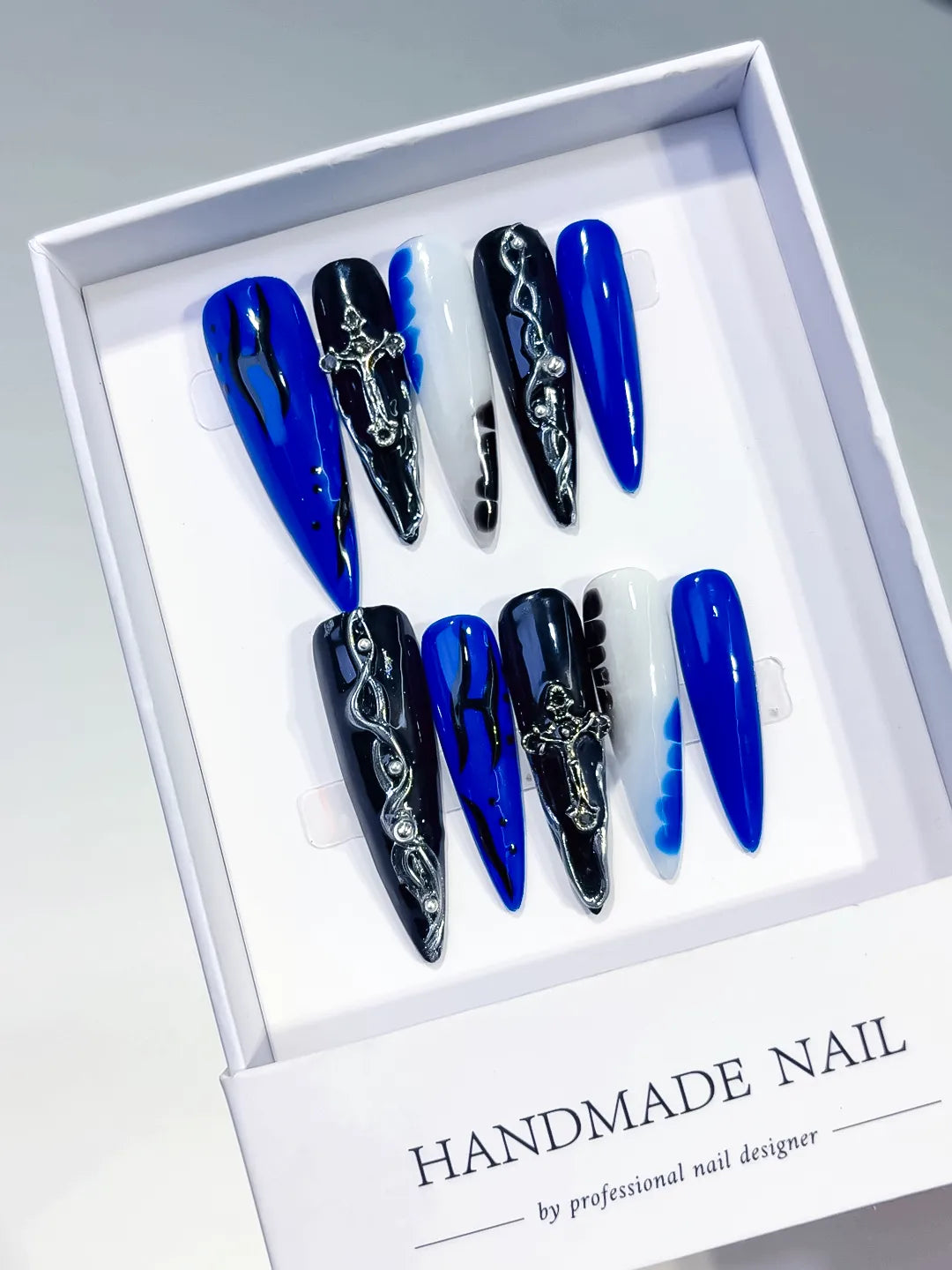 Blue Black White Silver Abstract Cross Chain press on nails angled view