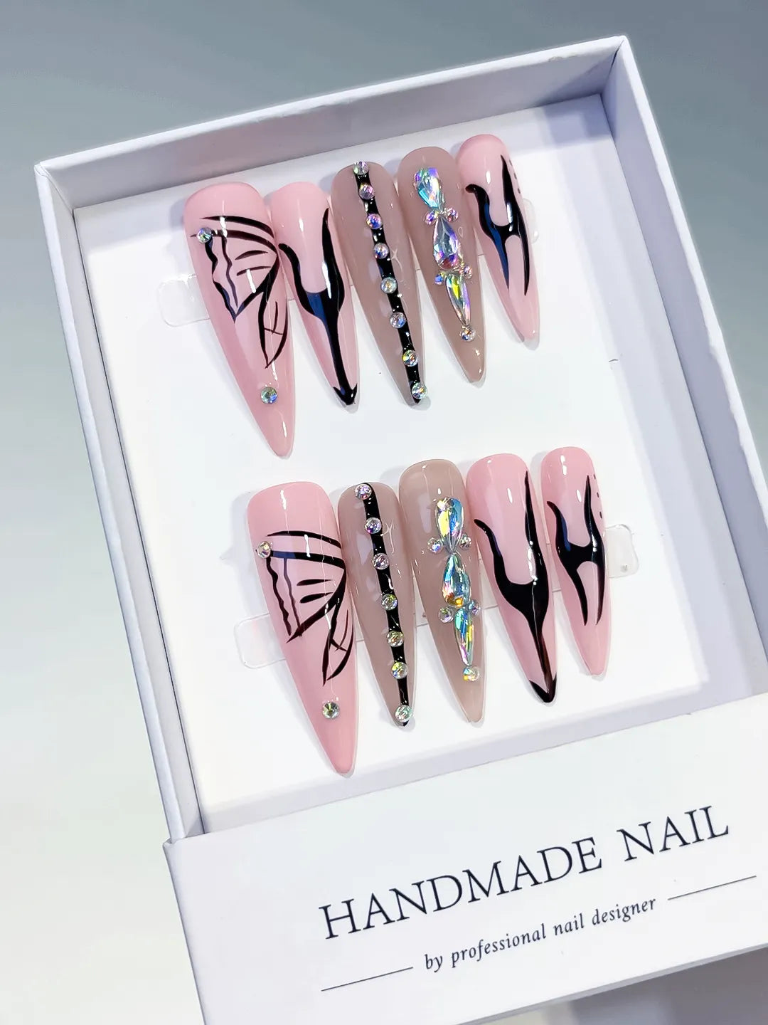 Pink Nude Black Silver Abstract Butterfly Rhinestone press on nails angled view