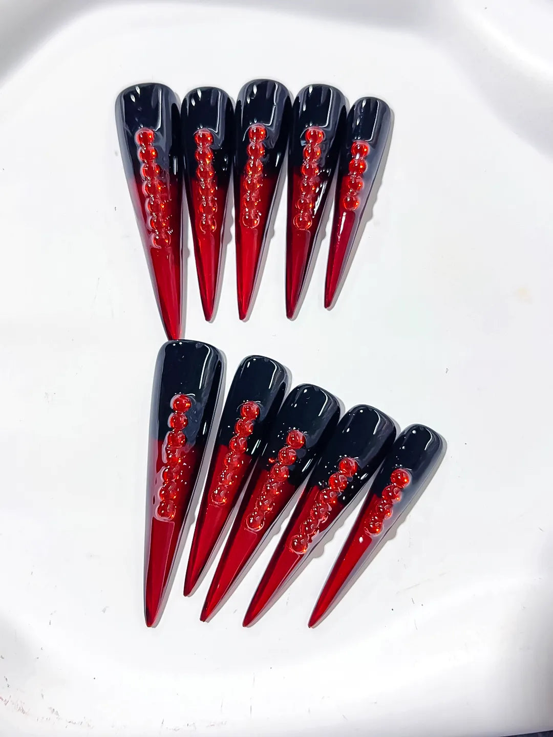 Black Red French tip Stud press on nails close up