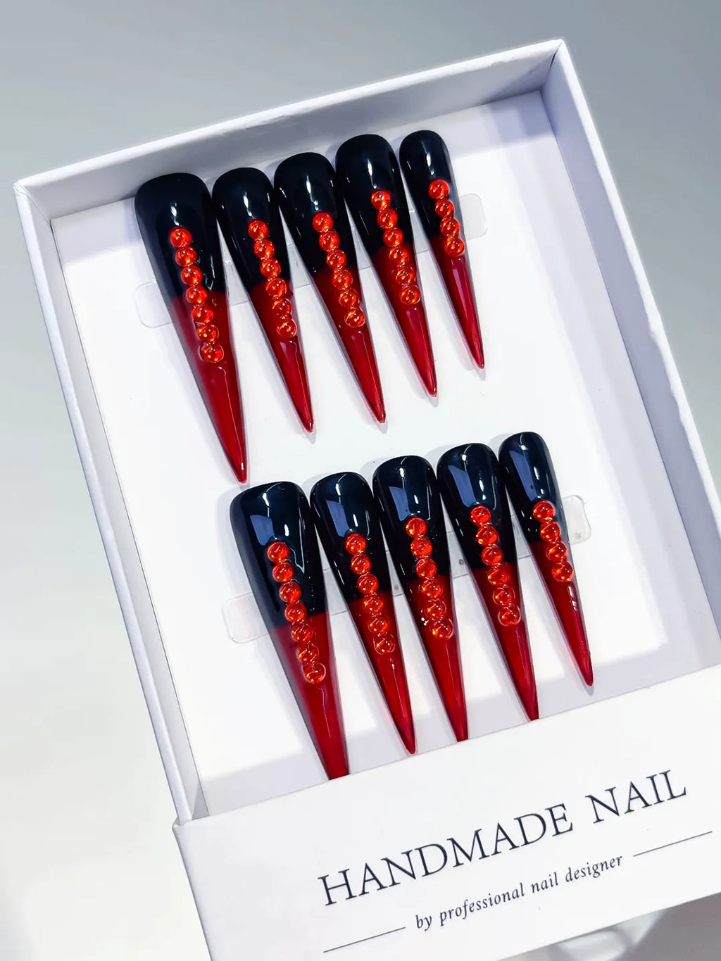 Black Red French tip Stud press on nails angled view