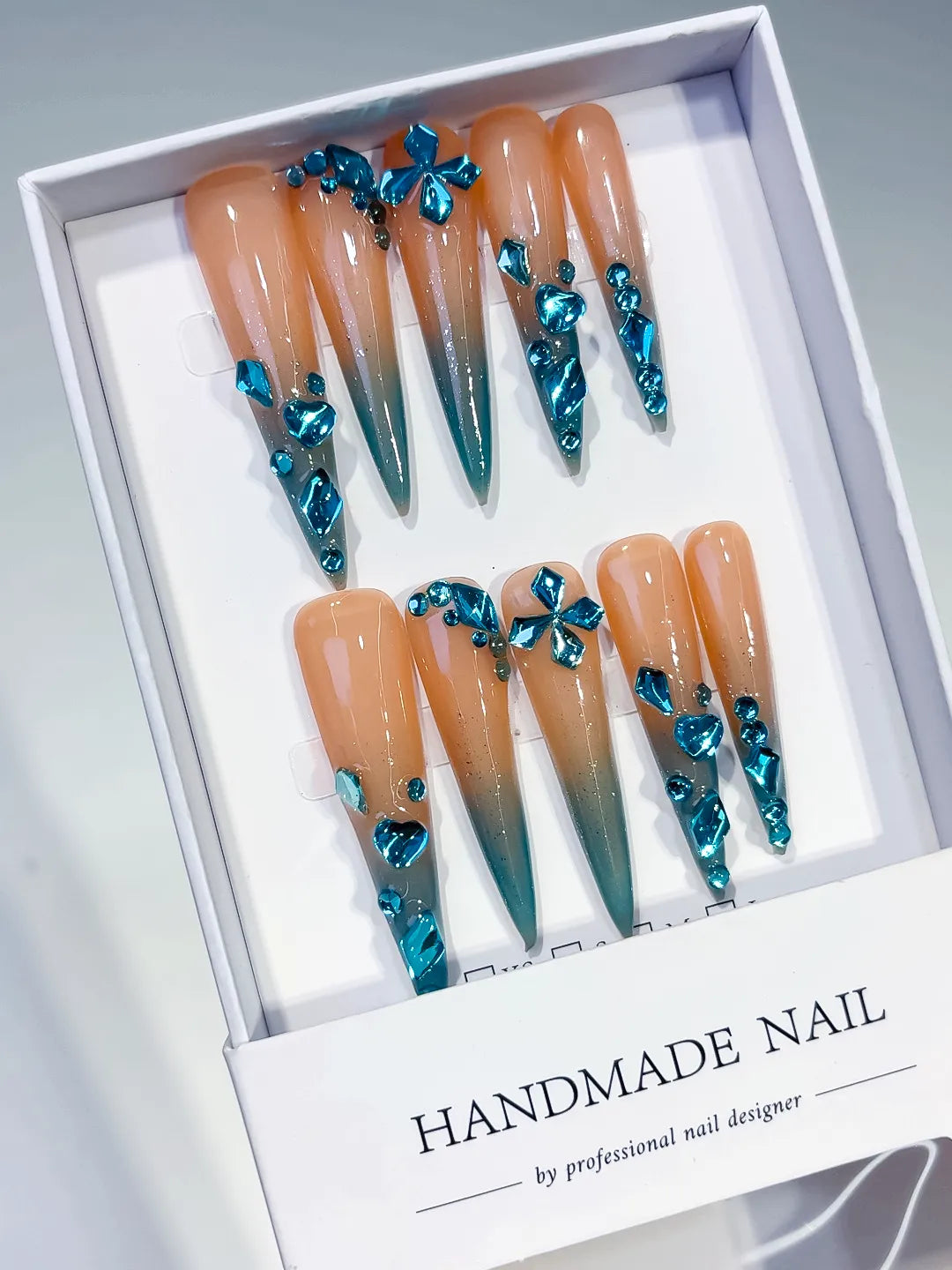 Nude Blue Silver Ombre Butterfly Rhinestone press on nails angled view