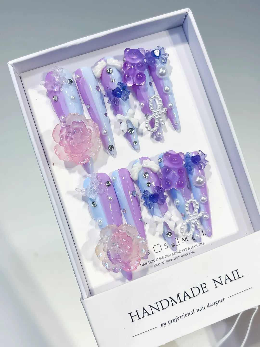 Purple Blue Pink White Silver Ombre Flower Bow Pearl Rhinestone 3D press on nails angled view