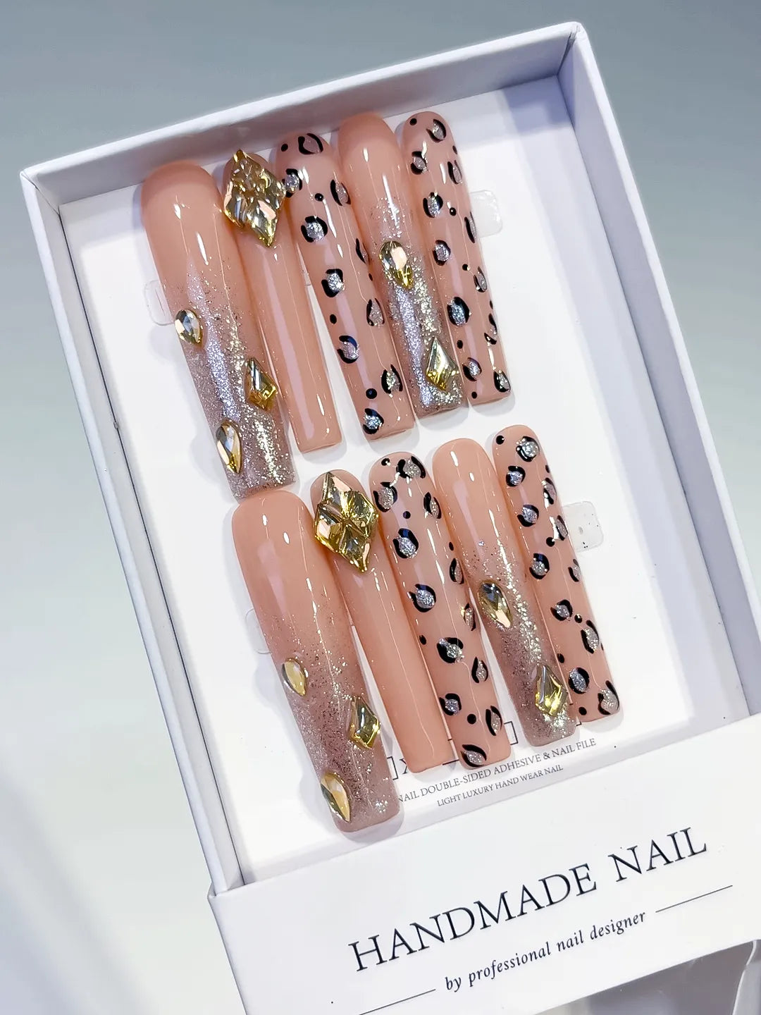 Nude Gold Black Silver Abstract Animal Print Rhinestone press on nails angled view