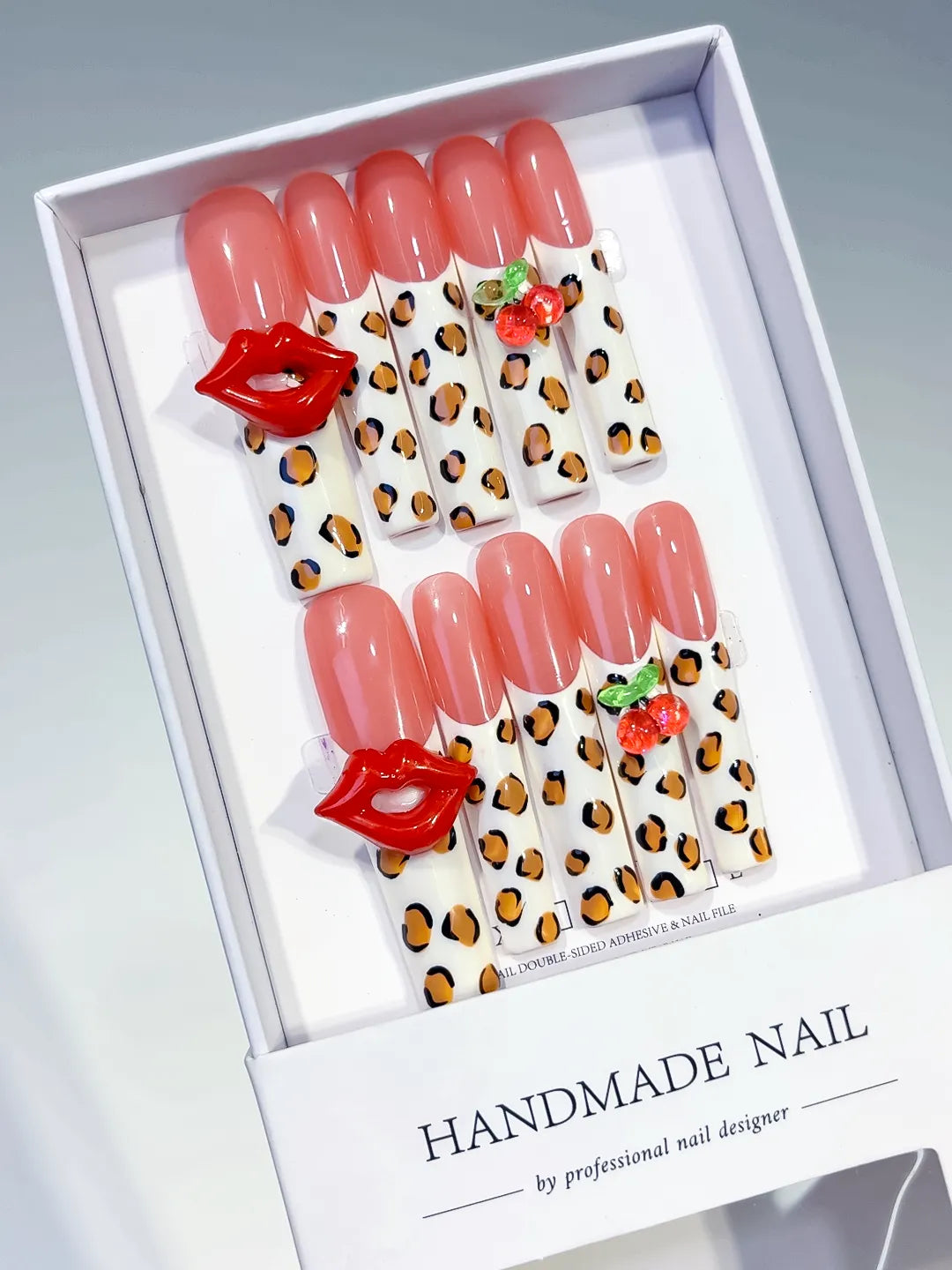 Nude Pink White Red Green Black Abstract Lip Print Strawberry Animal Print press on nails angled view