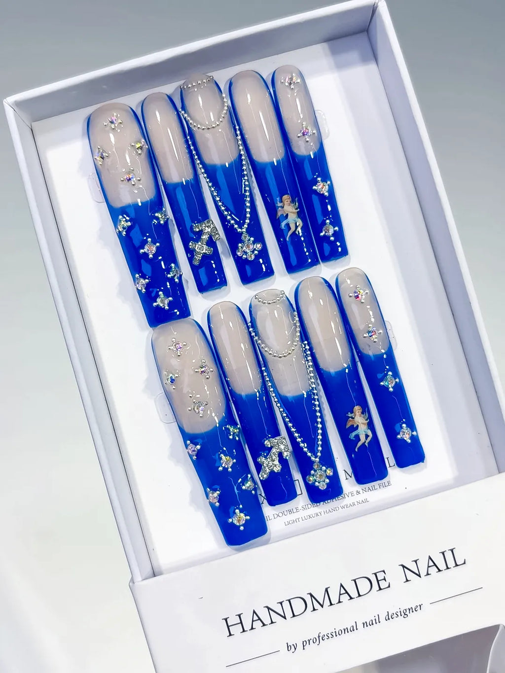 Nude Blue White Silver French tip Angel Cross Pearl Rhinestone press on nails angled view