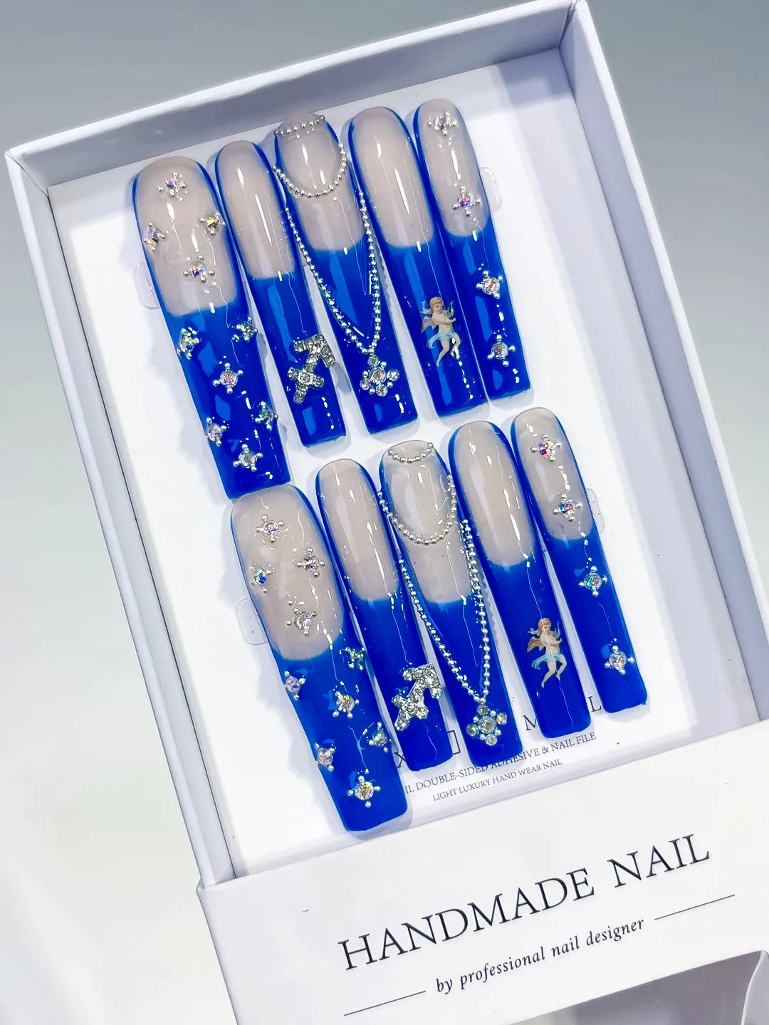 Nude Blue White Silver French tip Angel Cross Pearl Rhinestone press on nails angled view