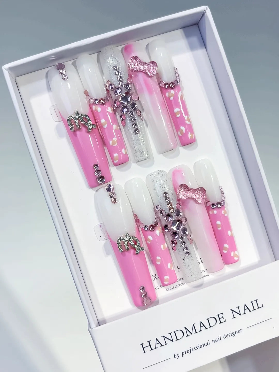 Pink White Silver Solid color Bow Heart Rhinestone press on nails angled view