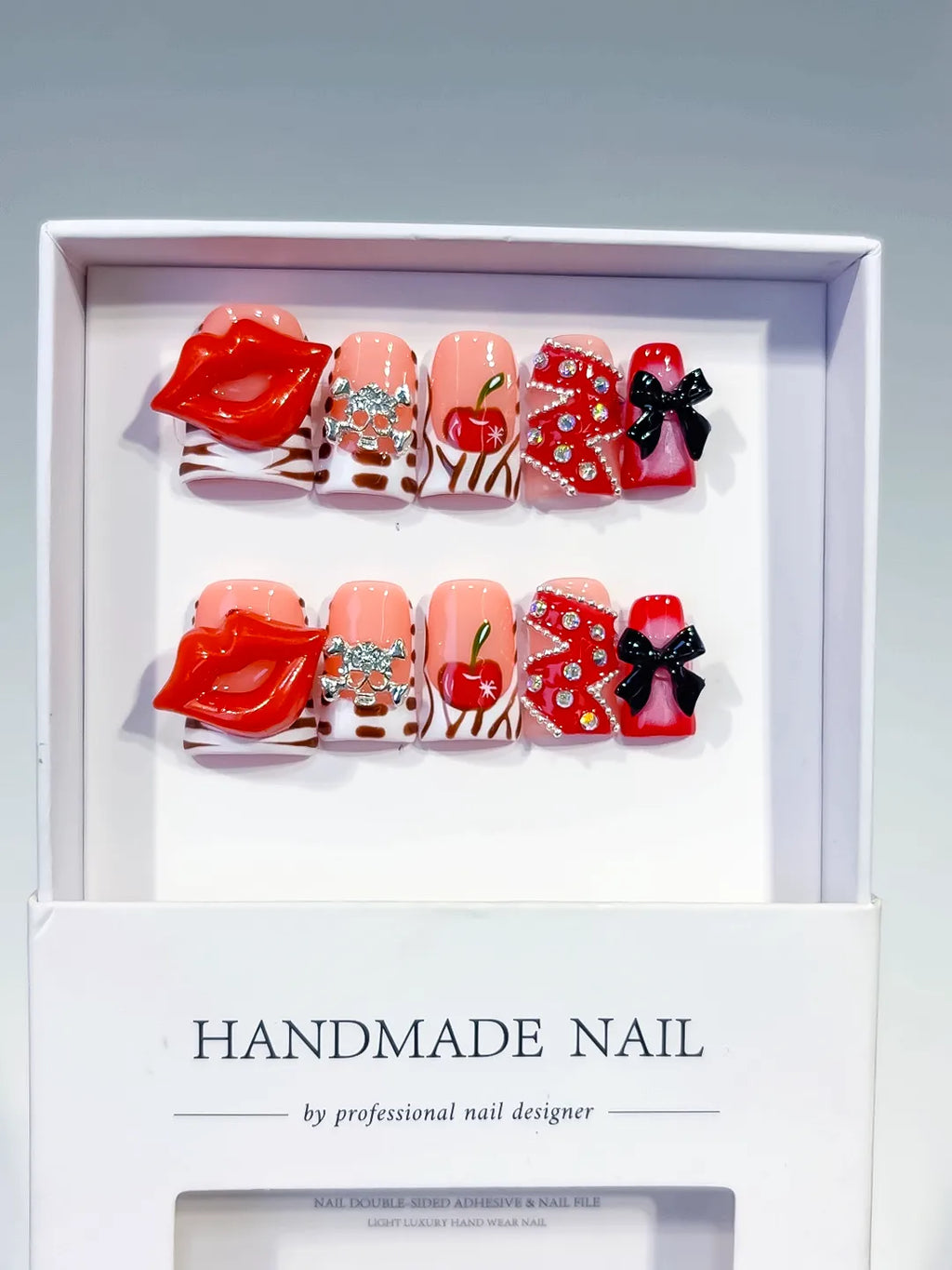 Nude Red Pink White Black Silver Abstract Lip Apple Bow Rhinestone 3D press on nails angled view