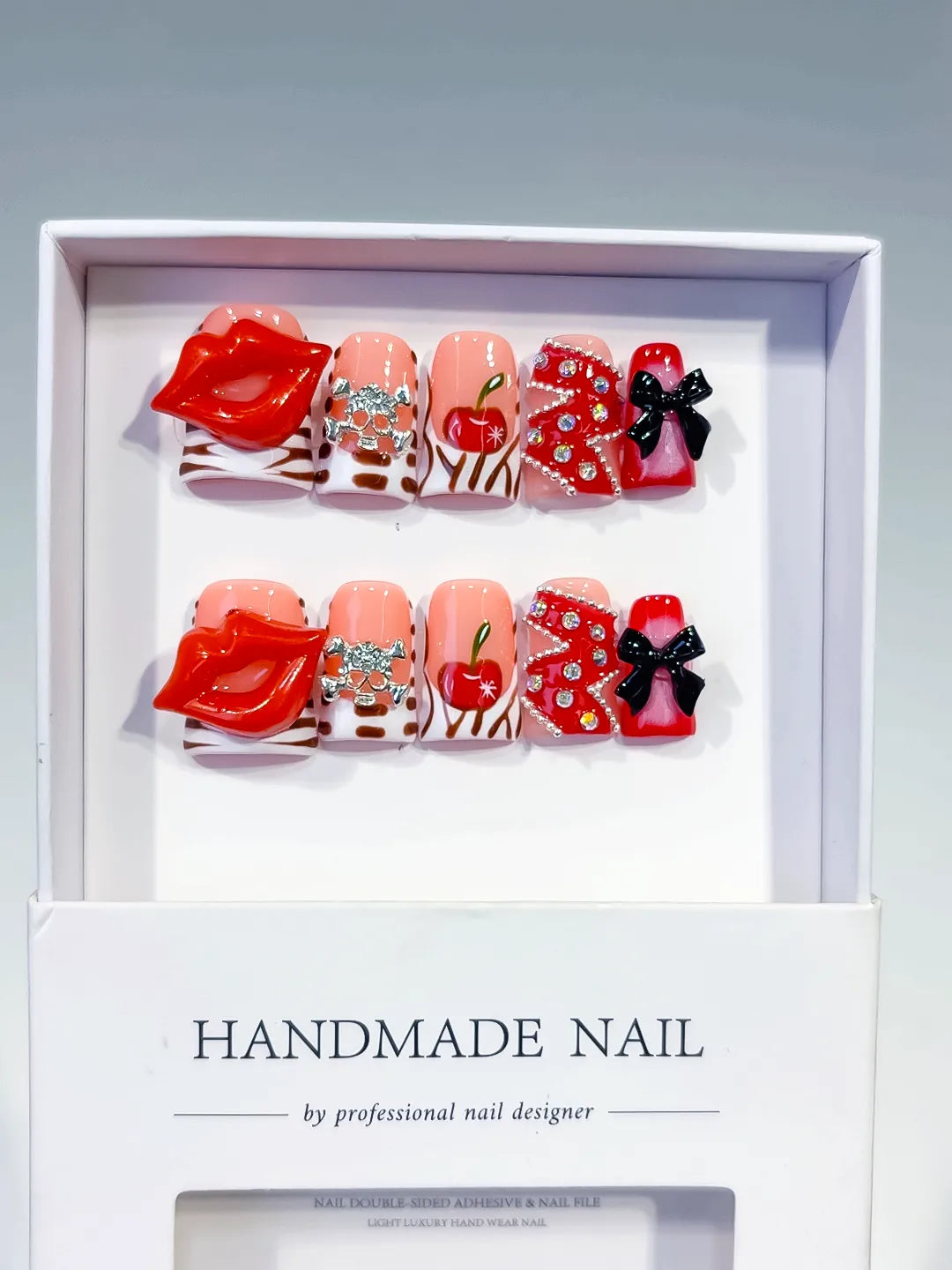 Nude Red Pink White Black Silver Abstract Lip Apple Bow Rhinestone 3D press on nails angled view