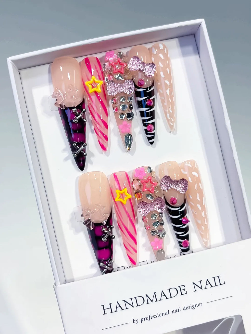Nude Pink Black White Yellow Silver Abstract Bow Star Rhinestone 3D press on nails angled view