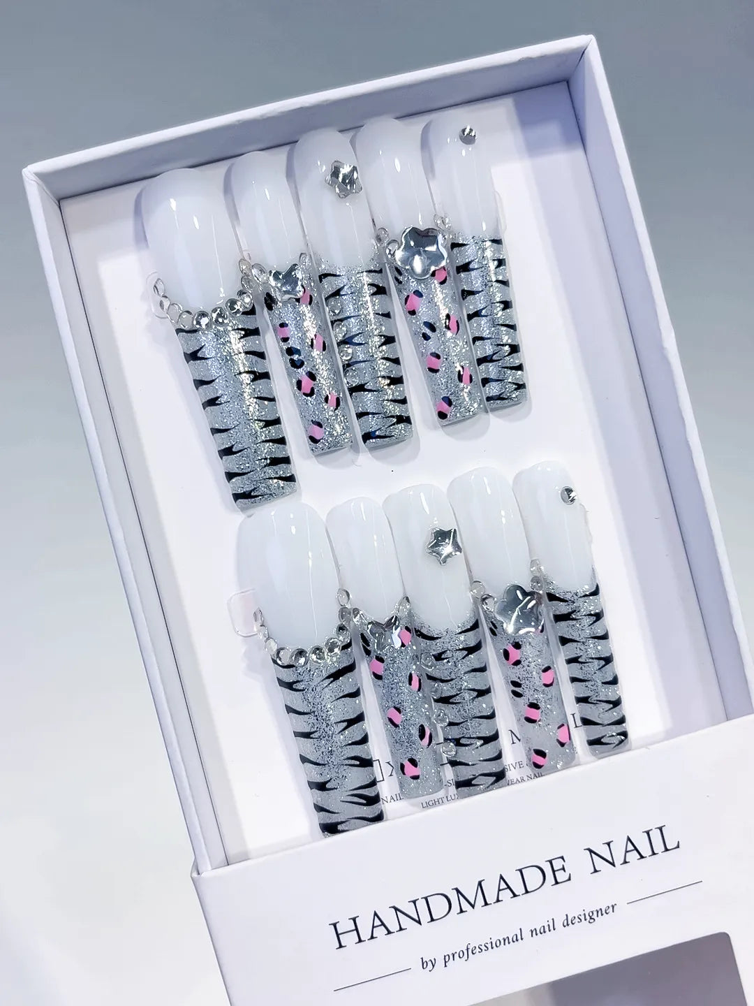 White Silver Black Pink Abstract Star Animal Print Rhinestone press on nails angled view
