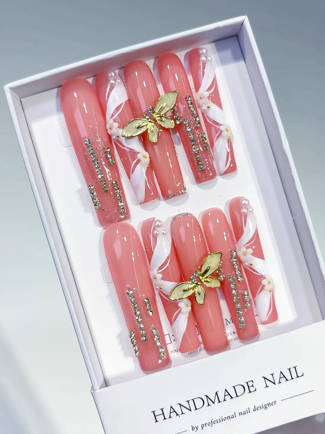 Pink White Gold Silver Abstract Butterfly Rhinestone press on nails angled view