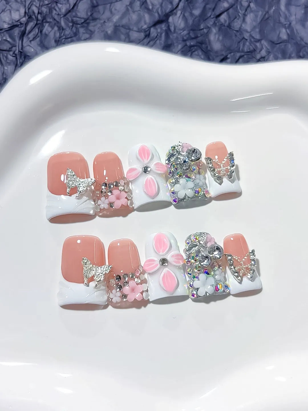 Nude White Pink Silver French tip Butterfly Flower Rhinestone 3D press on nails close up