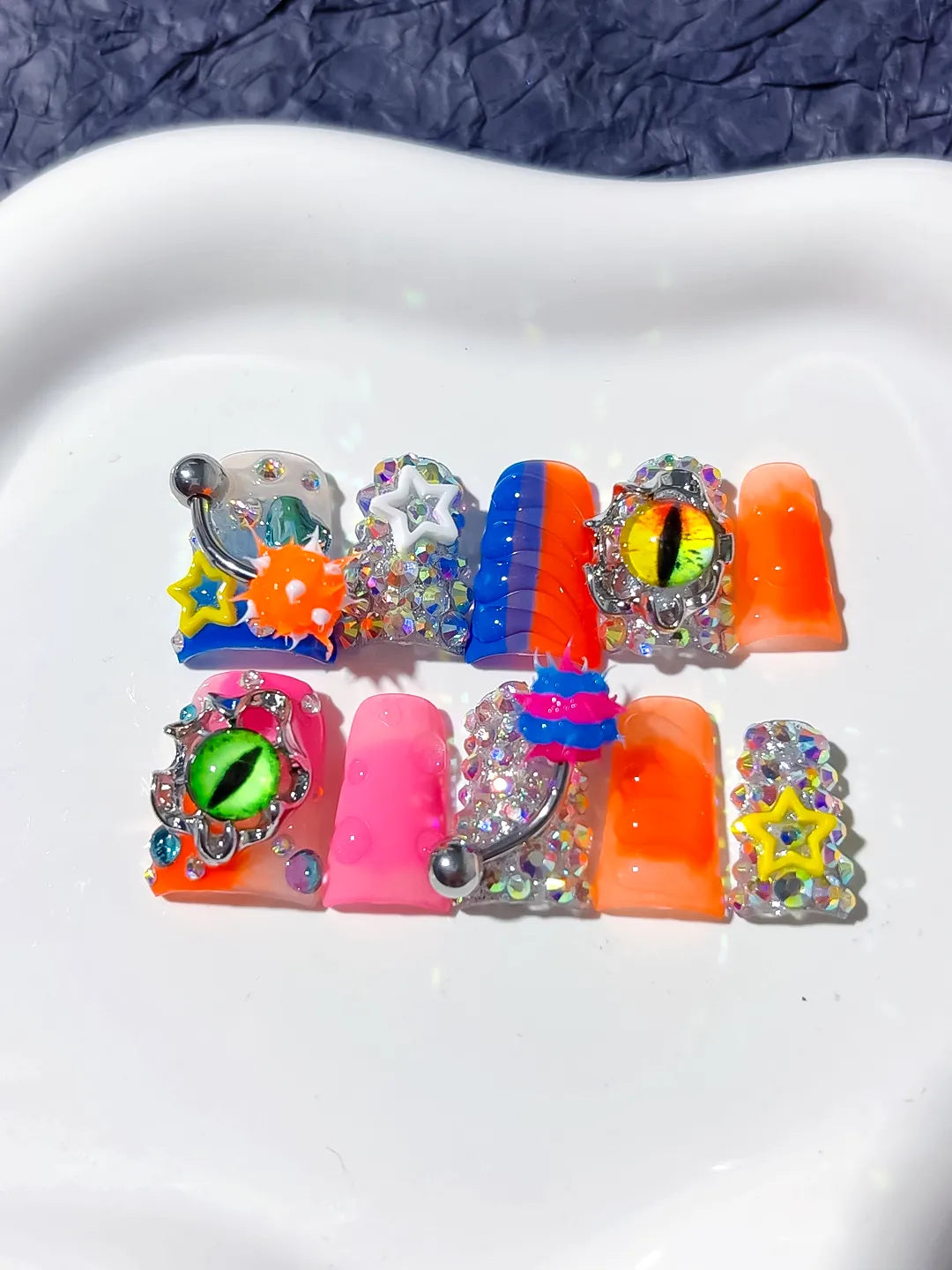 Blue Orange Pink Silver Black Yellow Abstract Star Eye Rhinestone 3D press on nails detail view
