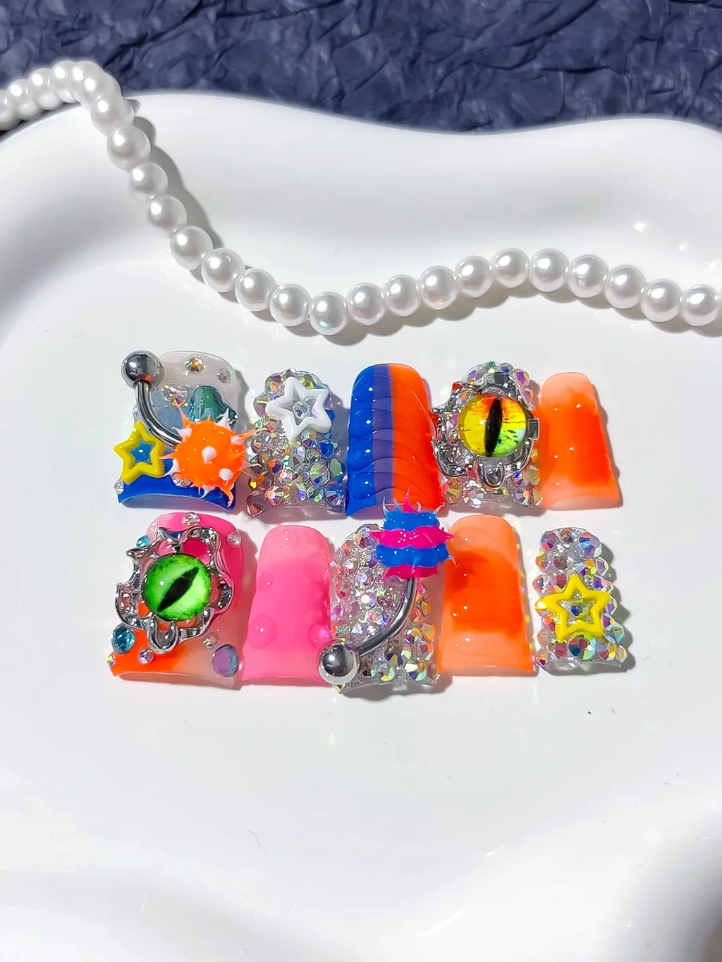 Blue Orange Pink Silver Black Yellow Abstract Star Eye Rhinestone 3D press on nails detail view