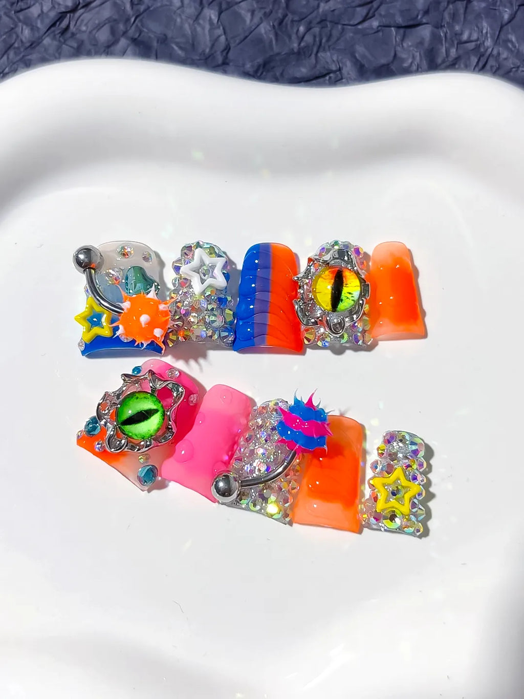 Blue Orange Pink Silver Black Yellow Abstract Star Eye Rhinestone 3D press on nails detail view