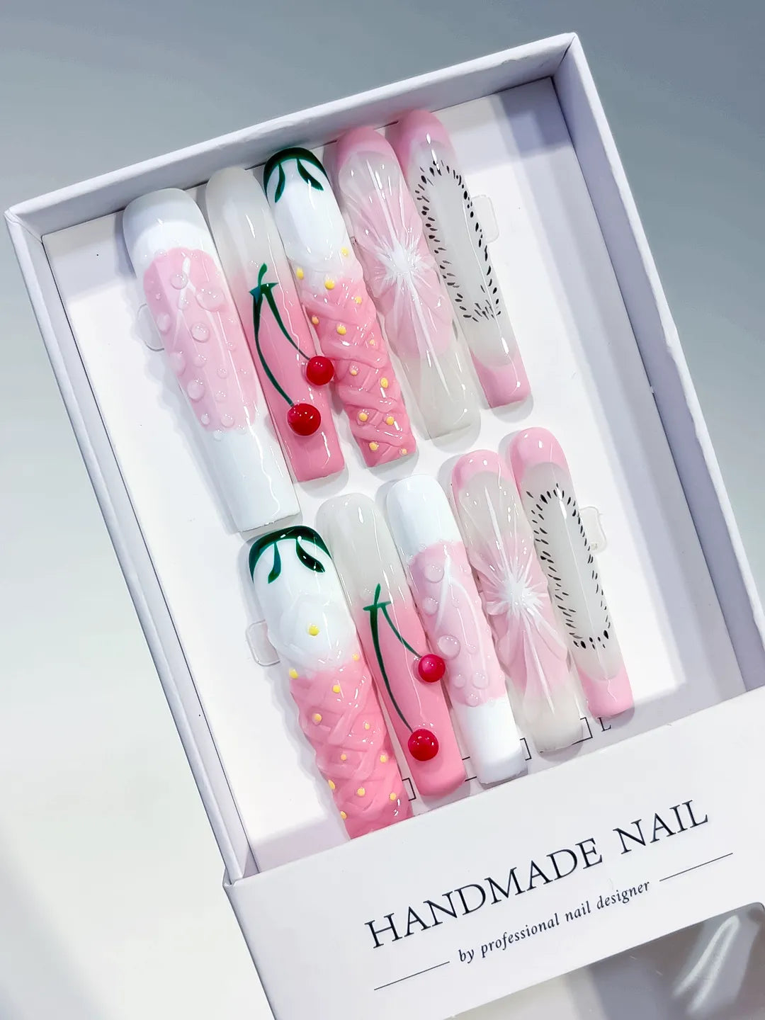 Pink White Green Black Abstract Cherry Floral press on nails angled view