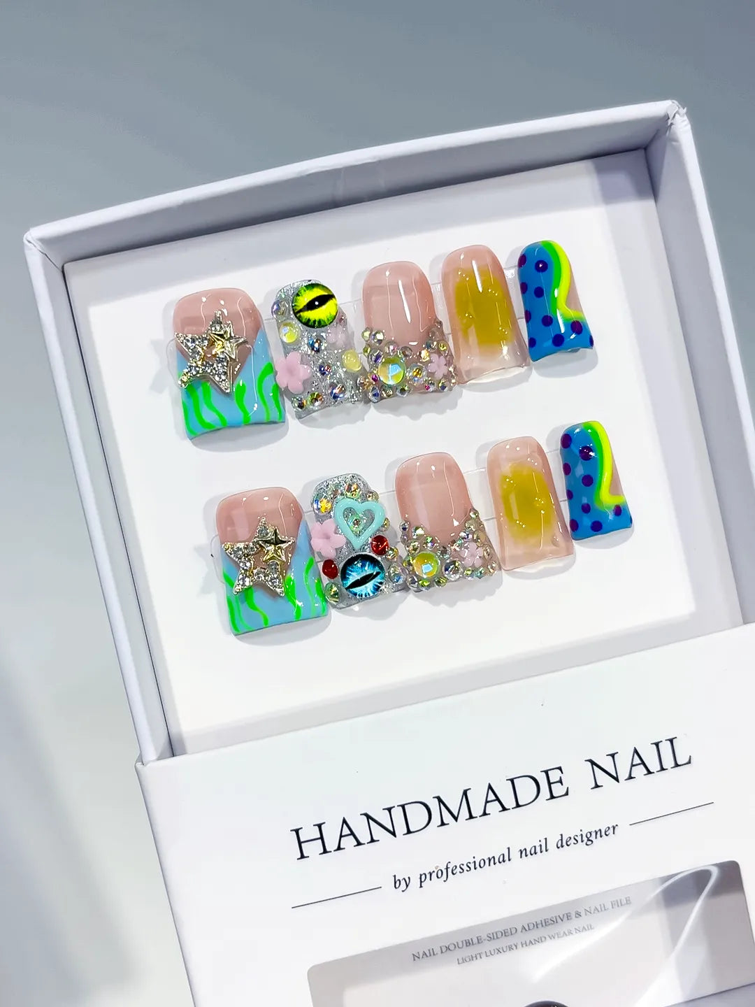 Nude Green Blue Yellow Pink Silver Abstract Flower Heart Eye Star Rhinestone press on nails angled view