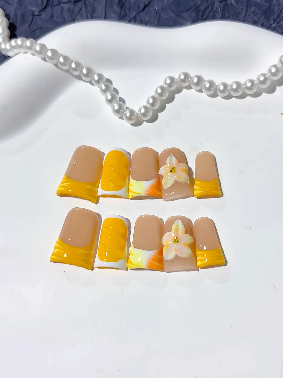 Nude Yellow White French tip Flower press on nails detail view