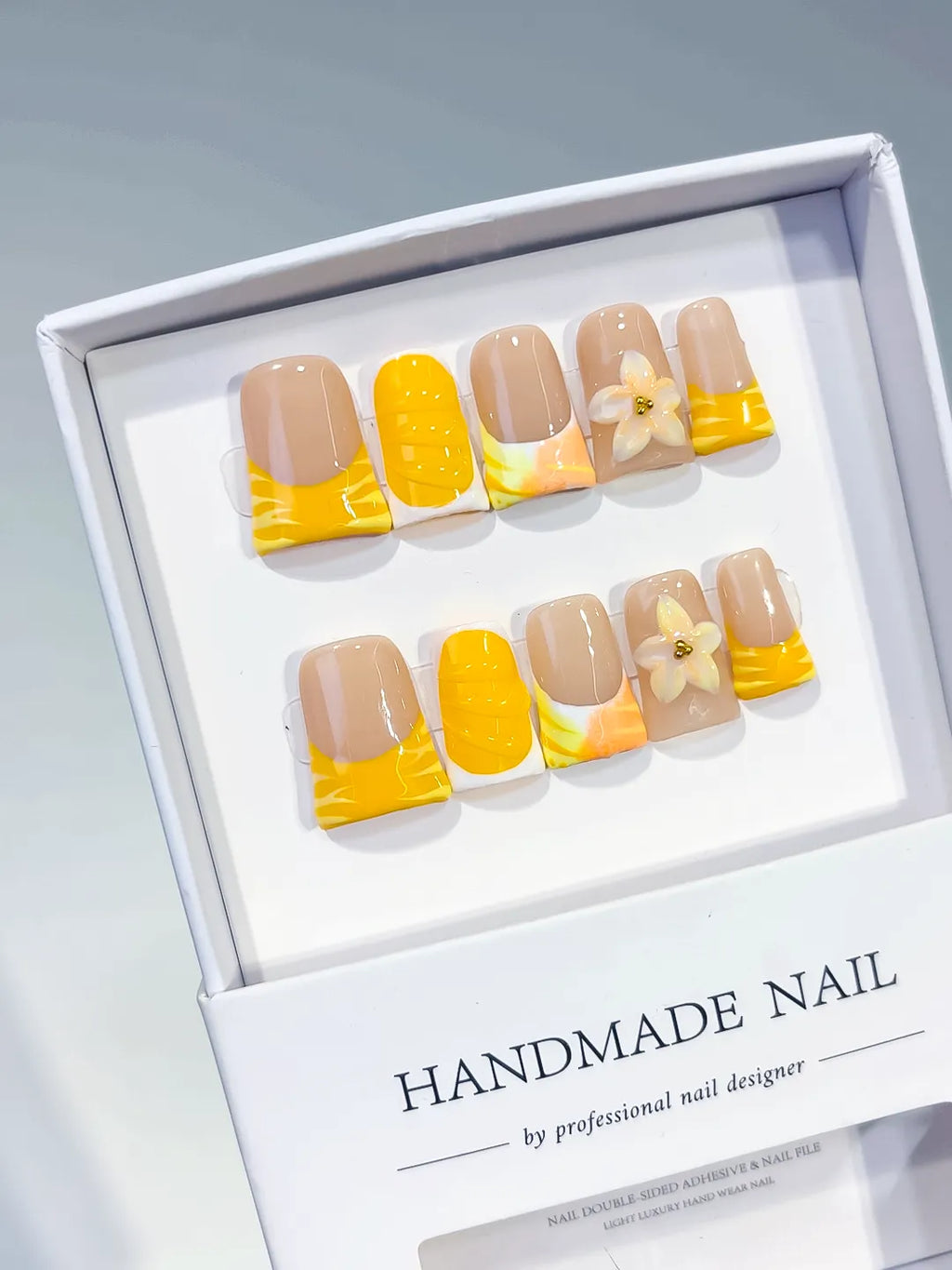 Nude Yellow White French tip Flower press on nails angled view