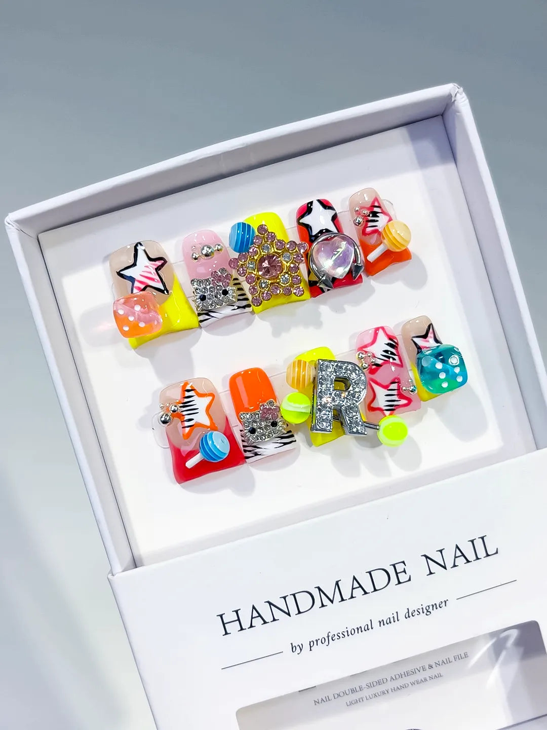 Orange Pink Yellow Red Silver Abstract Star Letter Flower Rhinestone 3D press on nails angled view