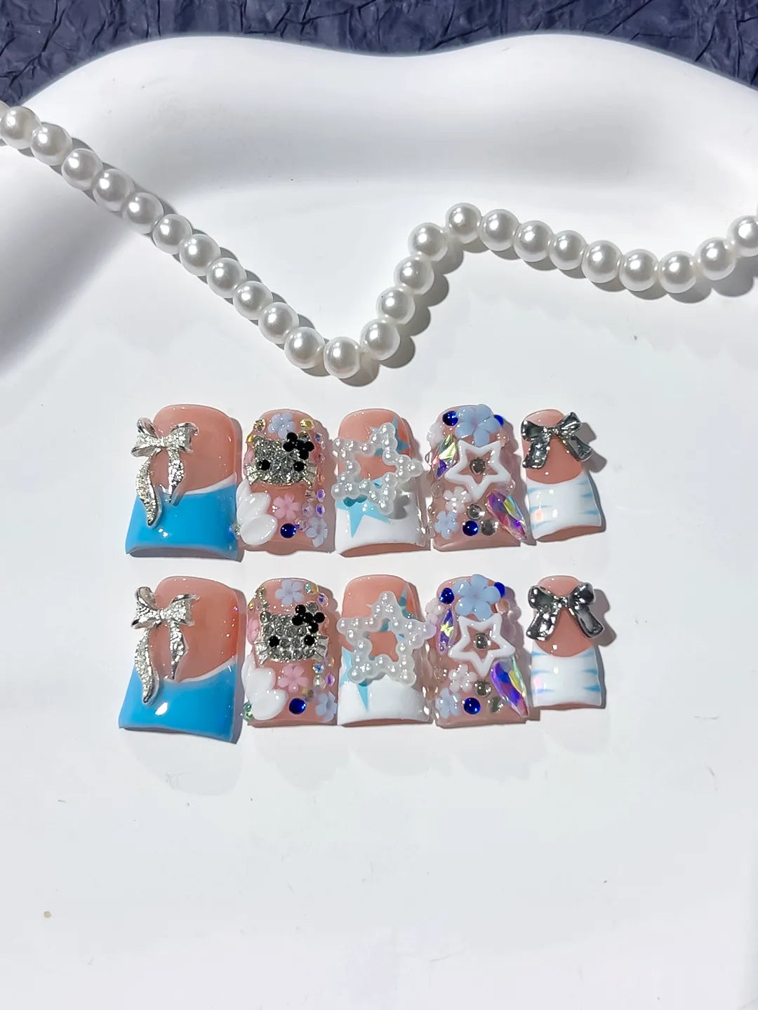 Nude Blue White Silver Abstract Bow Flower Star Rhinestone 3D press on nails close up